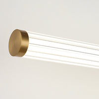 Close view of the brass end cap and ribbed acrylic tube on the Miralo wall light