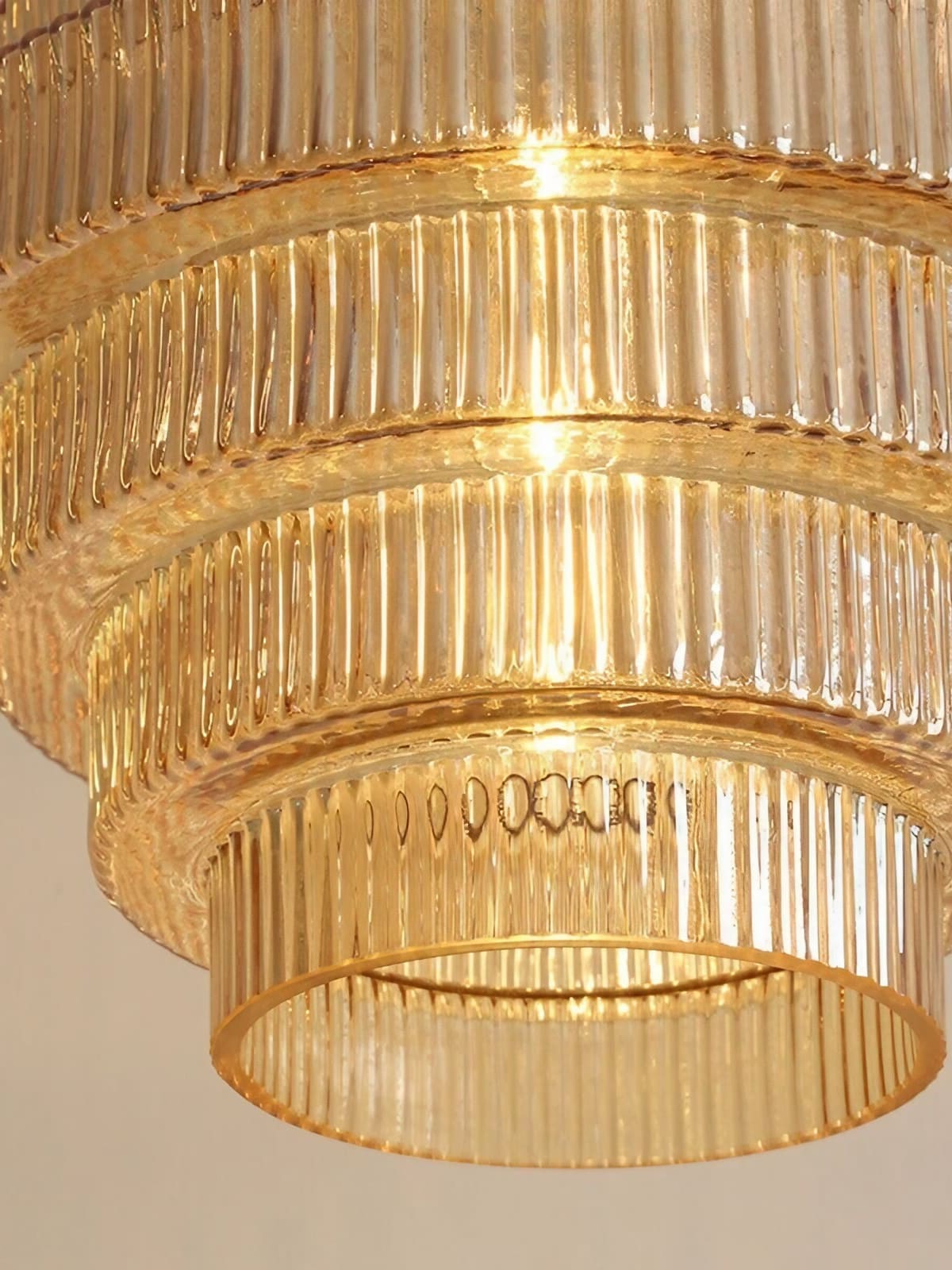 Close view of the vertical ribbing and stacked glass tiers on the Idra pendant light