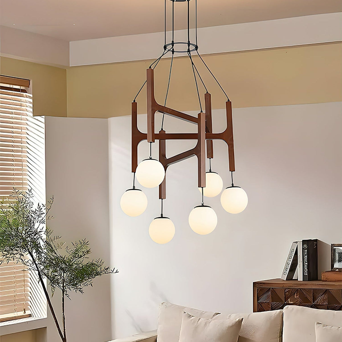 Zolven chandelier lit above a living room seating area