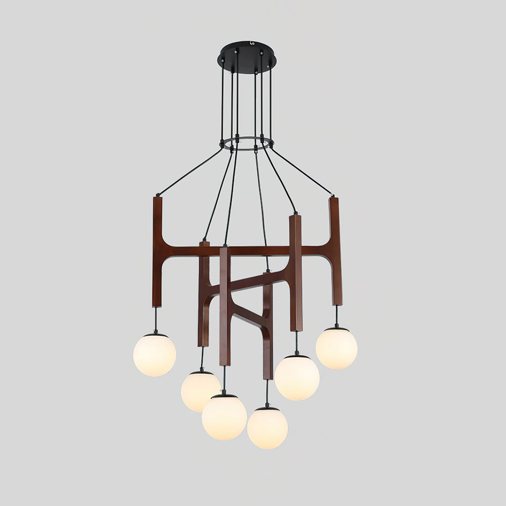 Zolven walnut chandelier lit, showing six opal glass globes on staggered cables