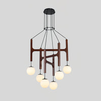 Zolven walnut chandelier lit, showing six opal glass globes on staggered cables