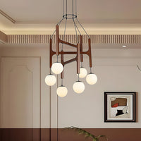Zolven walnut globe chandelier hanging in a panelled dining room