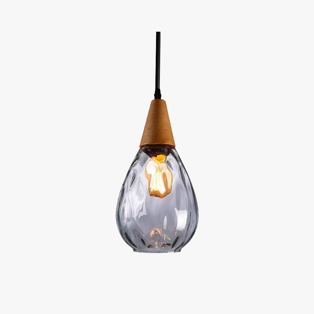 Drova teardrop clear dimpled glass pendant light on a plain white background