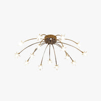 Nevaro starburst ceiling light in gold with fifteen clear glass star diffusers on a plain white background