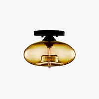 Valto Globe Ceiling Light with amber glass shade on a black flush mount