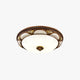 Epora Antique Brass Ceiling Light on a plain white background showing the ornate brass rim and frosted glass dome