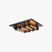 Grindo black square industrial flush mount ceiling light with four tubular filament bulbs on a plain white background