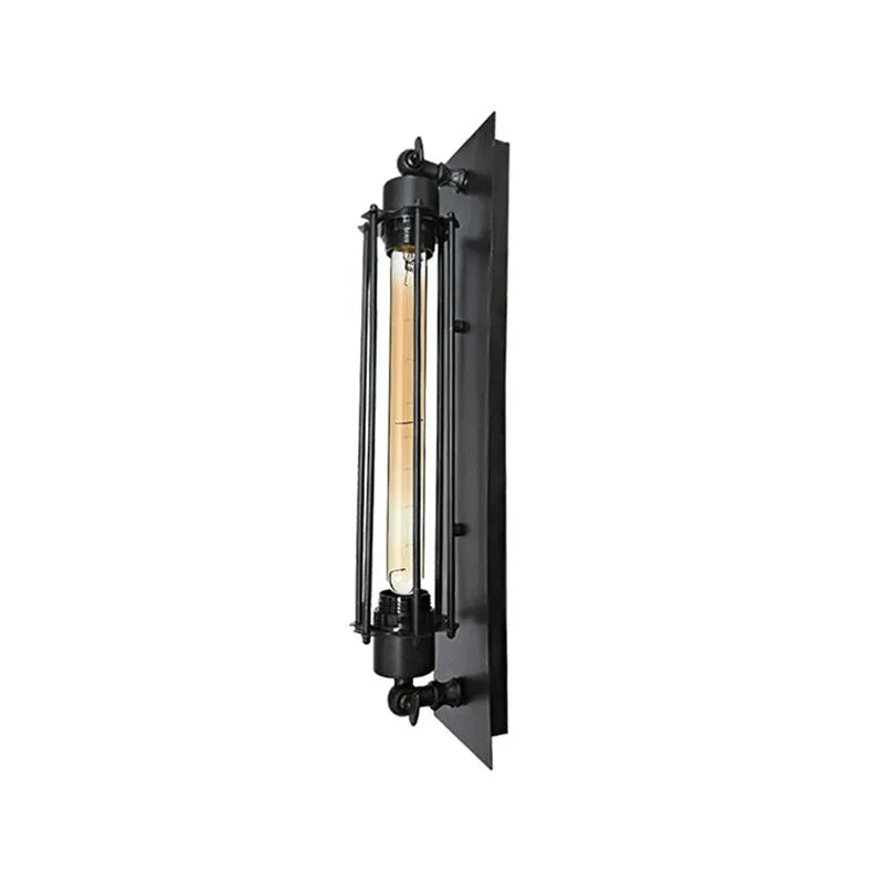 Trono black cage wall light shown lit against a plain background, warm filament glowing inside the cage