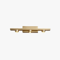 Nolvo triple spot brass vanity wall light shown on a plain white background