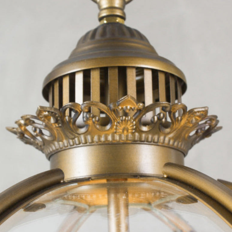 Close view of the cast brass crown at the top of the Edvo Retro Globe Pendant Light