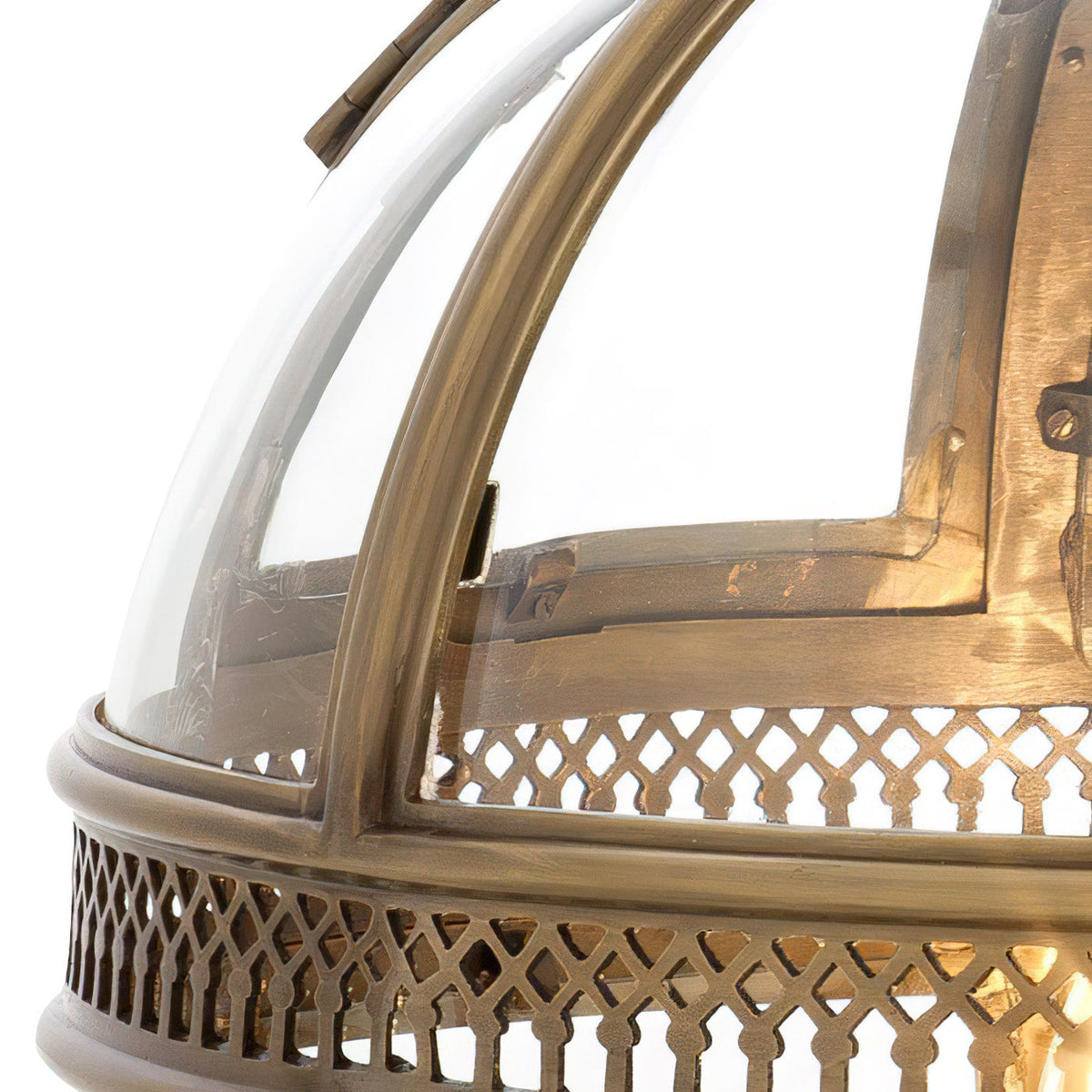 Detail of the pierced brass fretwork band and glass on the Edvo Retro Globe Pendant Light
