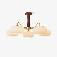 Sova Persimmon Glass Brass Chandelier - five frosted glass globes on antique brass arms with dark walnut column, plain background