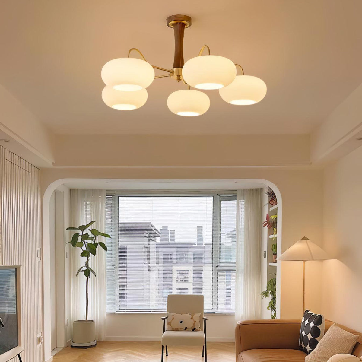 Sova chandelier in a modern living room with large windows
