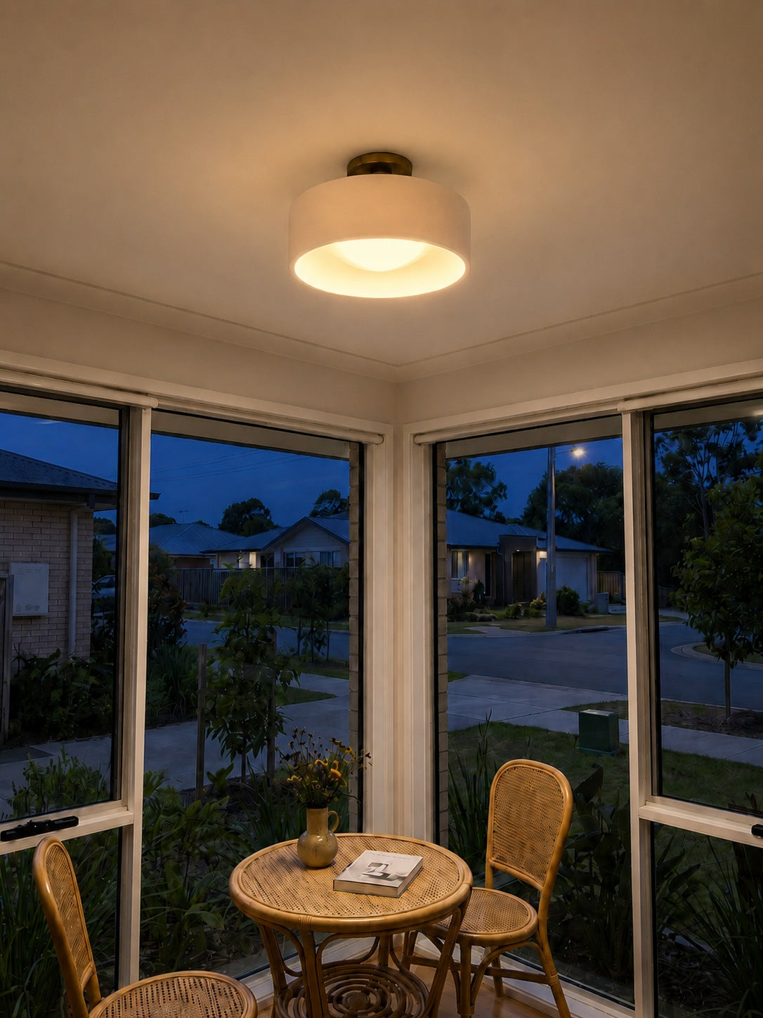 Cera porcelain flush ceiling light shown in a modern interior