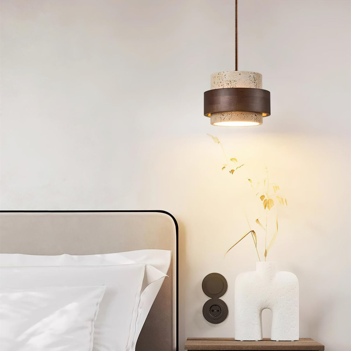 Cavora pendant light used as bedside lighting above a small side table