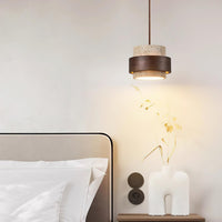 Cavora pendant light used as bedside lighting above a small side table