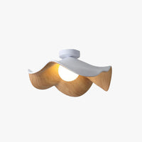 Tamsi wavy wood flush mount ceiling light with white canopy and wood-grain petal shade on a plain background