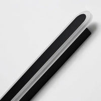 Close-up detail of the Orvo acrylic diffuser and black metal body