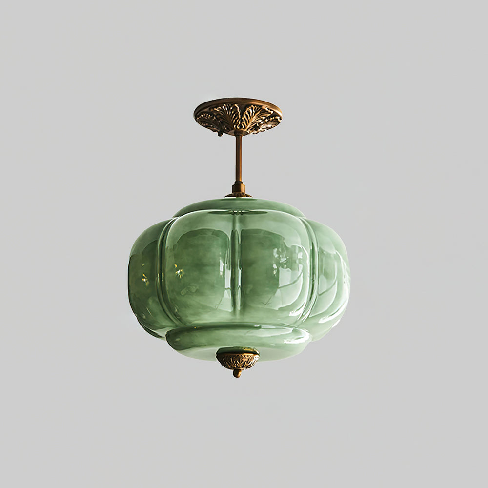 Eldo green glass ceiling light seen from below, showing the ribbed glass lobes and the gold base finial