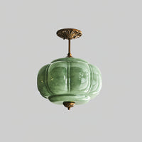 Eldo green glass ceiling light seen from below, showing the ribbed glass lobes and the gold base finial