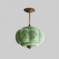 Eldo green glass semi flush mount light shown with a longer gold stem on a plain background