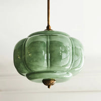 Eldo green glass ceiling light fitted close to a white ceiling in a bright room