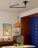 Delvec amber swing arm pendant in mid-century modern dining room