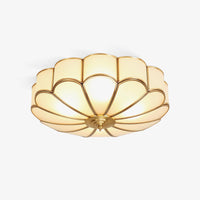 Ulina petal glass ceiling light on a plain white background, frosted glass panels in a brass finish frame