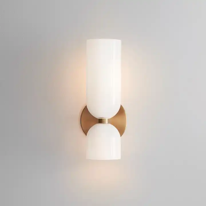 Solia Twin Glass Wall Sconce on a plain background showing the opal glass cylinder, brass bracket and lower glass cup