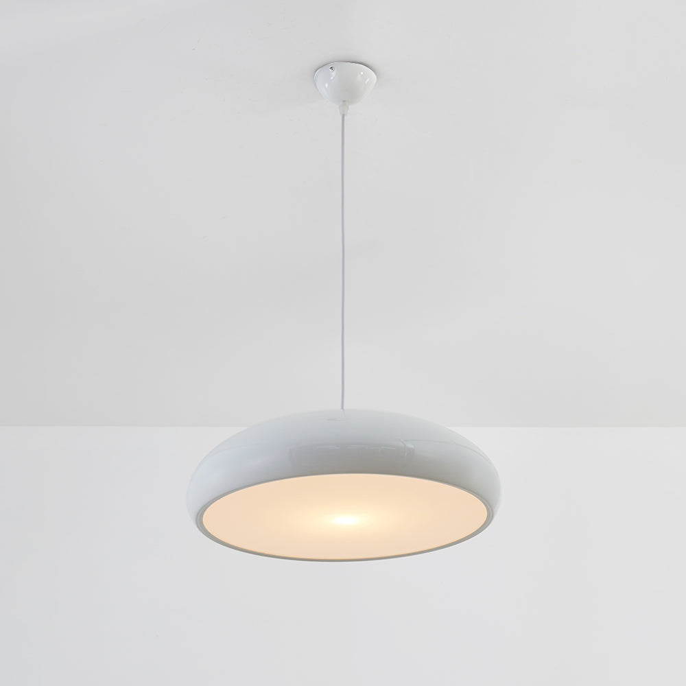 Liro white dome pendant light switched on, showing the warm downward glow from the shade