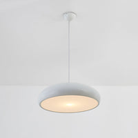 Liro white dome pendant light switched on, showing the warm downward glow from the shade