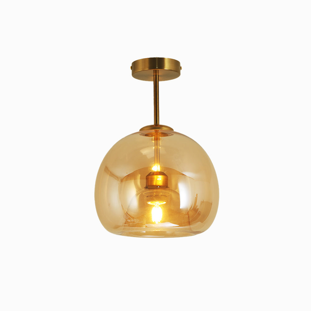 Belvo amber glass dome semi flush ceiling light with brass rod on a plain white background