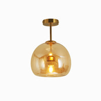 Belvo amber glass dome semi flush ceiling light with brass rod on a plain white background