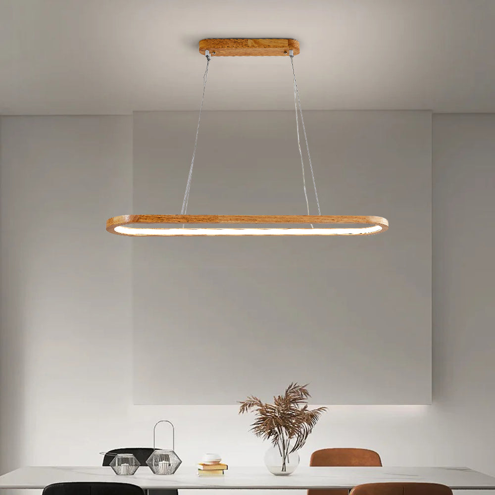 Veona oval wood pendant light hanging on steel cables from a slim wooden ceiling canopy above a dining table