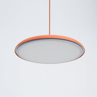 Underside view of the Tarvo orange pendant light showing the flat diffuser panel and orange rim