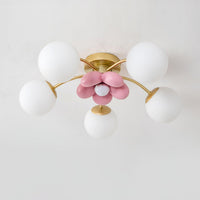 Peona ceiling light fitted flush to a white ceiling, pink resin flower centre lit from within