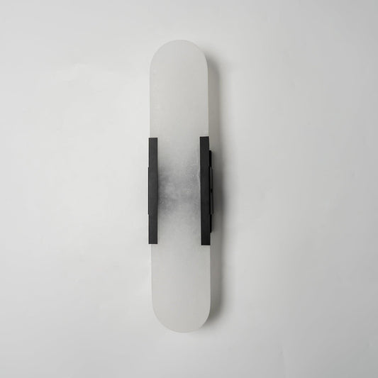 Lockhone Veola alabaster wall light with black metal bars, unlit, on a plain pale wall