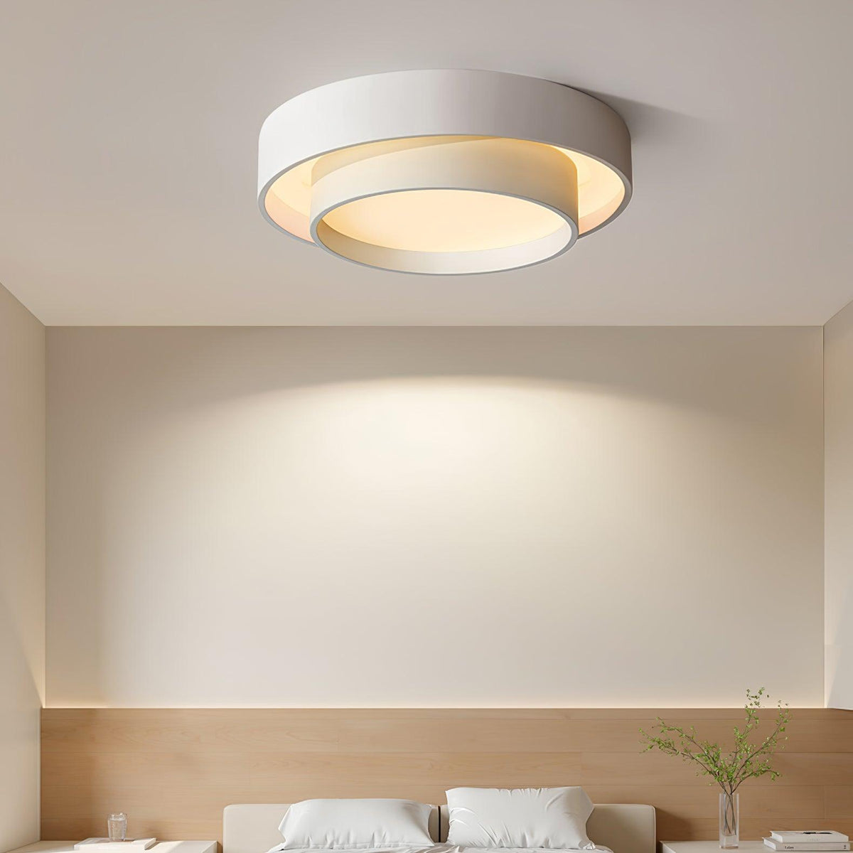 Belna ceiling light lit above a bed in a bedroom with a timber headboard