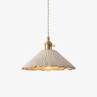 Plavo scalloped cement pendant light with brass holder on a plain pale background