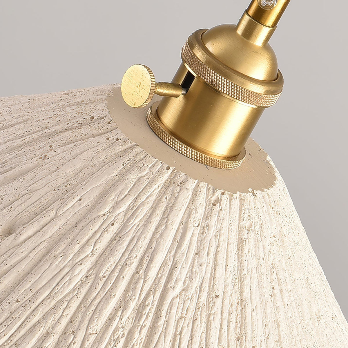 Close up of the knurled brass lamp holder and thumb screw on the Plavo pendant