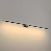Close view of the Ivo wall light bar and gold hub with warm light washing the wall