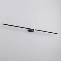 Ivo slim black and gold LED wall light shown at an angle against a pale grey wall