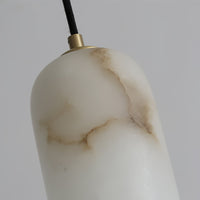 Close view of the Uvella alabaster shade showing the natural veining in the stone