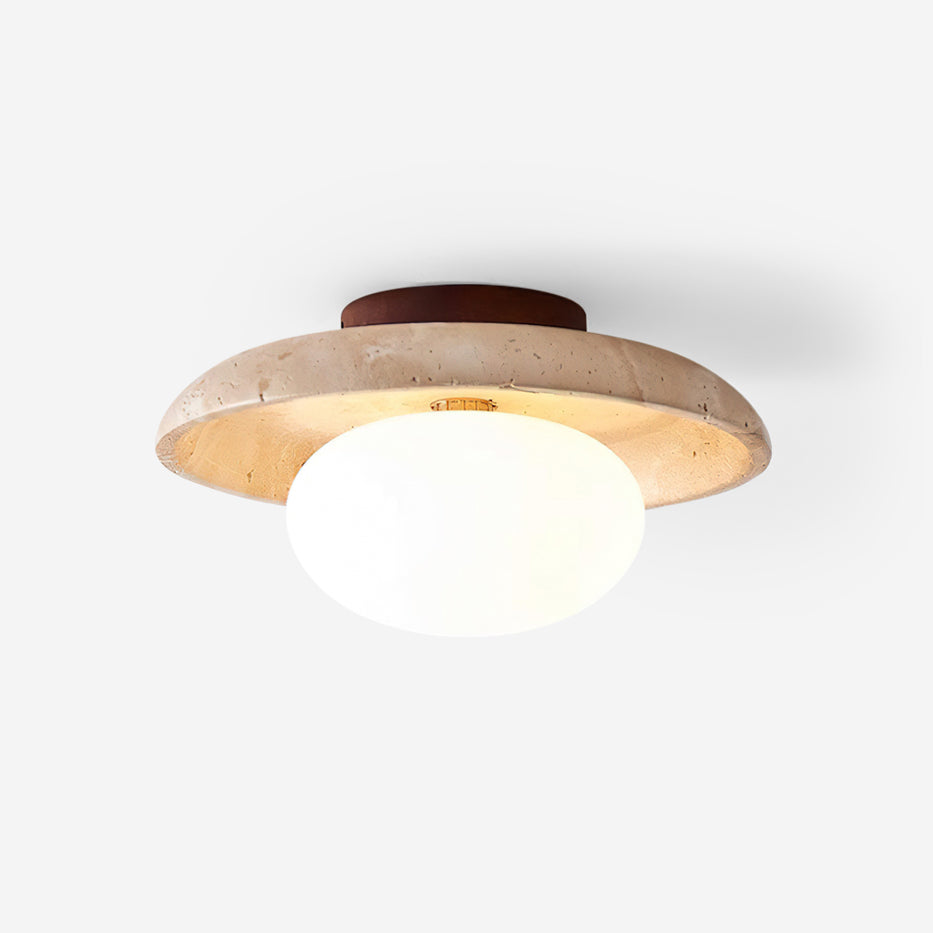 Renvo travertine disc flush ceiling light with opal glass dome on a plain white background