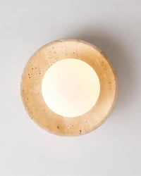 Renvo ceiling light viewed from directly below showing the travertine ring around the lit glass dome