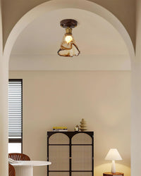Orva Amber Glass Semi-Flush Light in an arched alcove living area