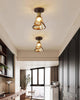 Orva Amber Glass Semi-Flush Light installed in a contemporary hallway