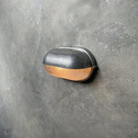 Angled view of the Estwin outdoor wall light showing how far the fitting stands off the wall