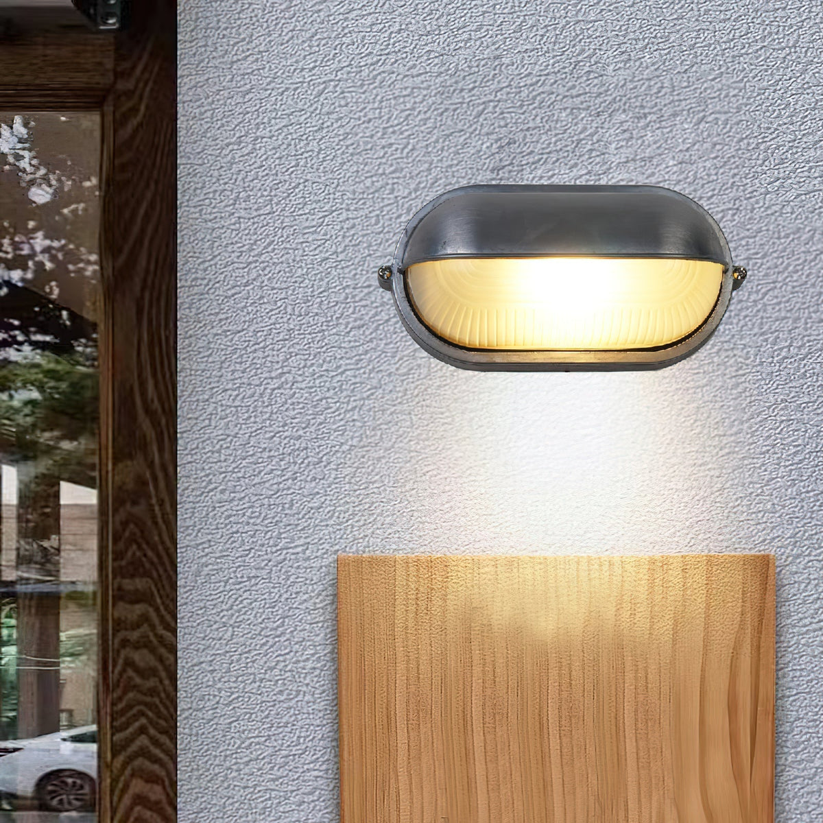 Estwin bulkhead light mounted beside a timber panel, casting light down the wall