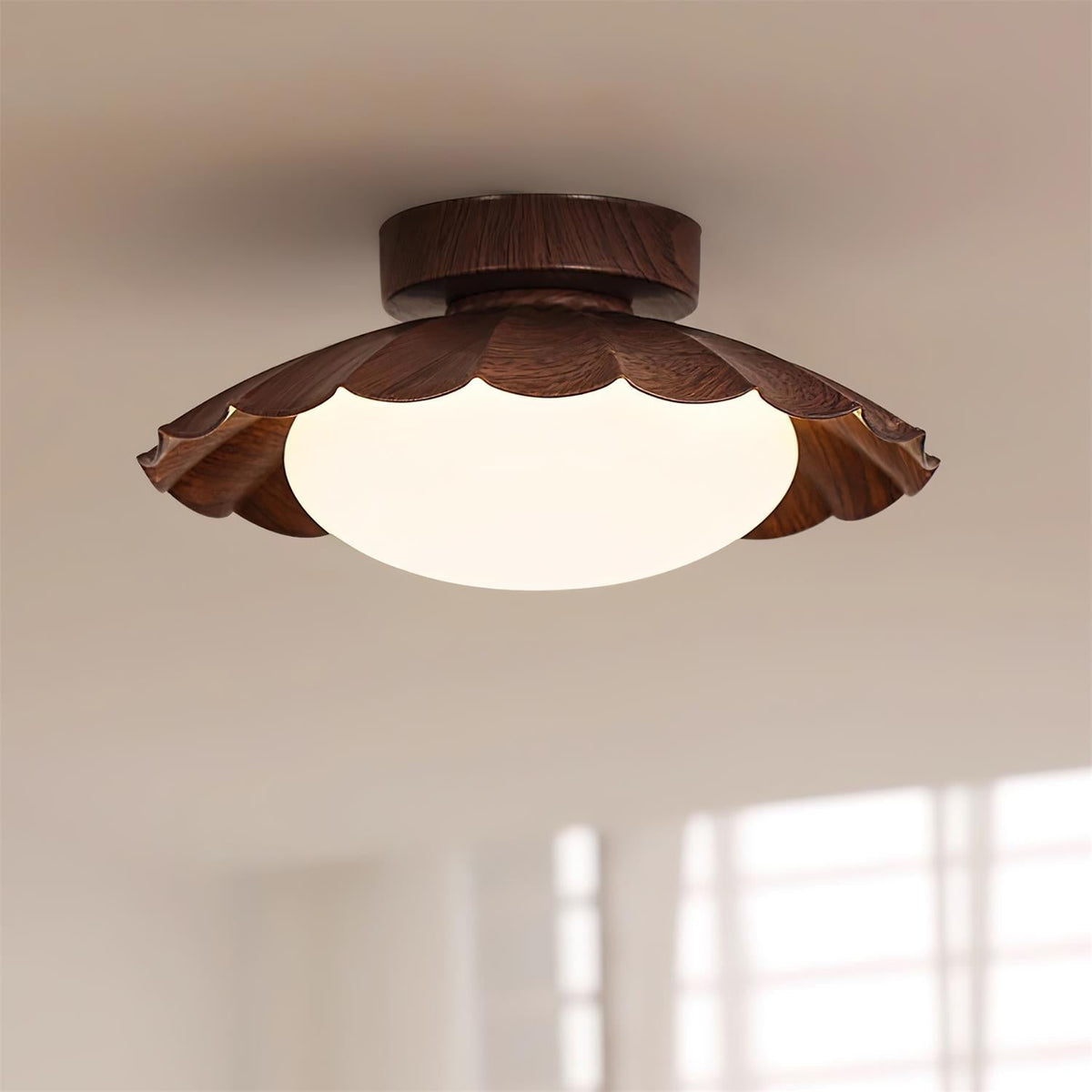 Wynto walnut flush mount ceiling light fitted to a white ceiling in a daylit room